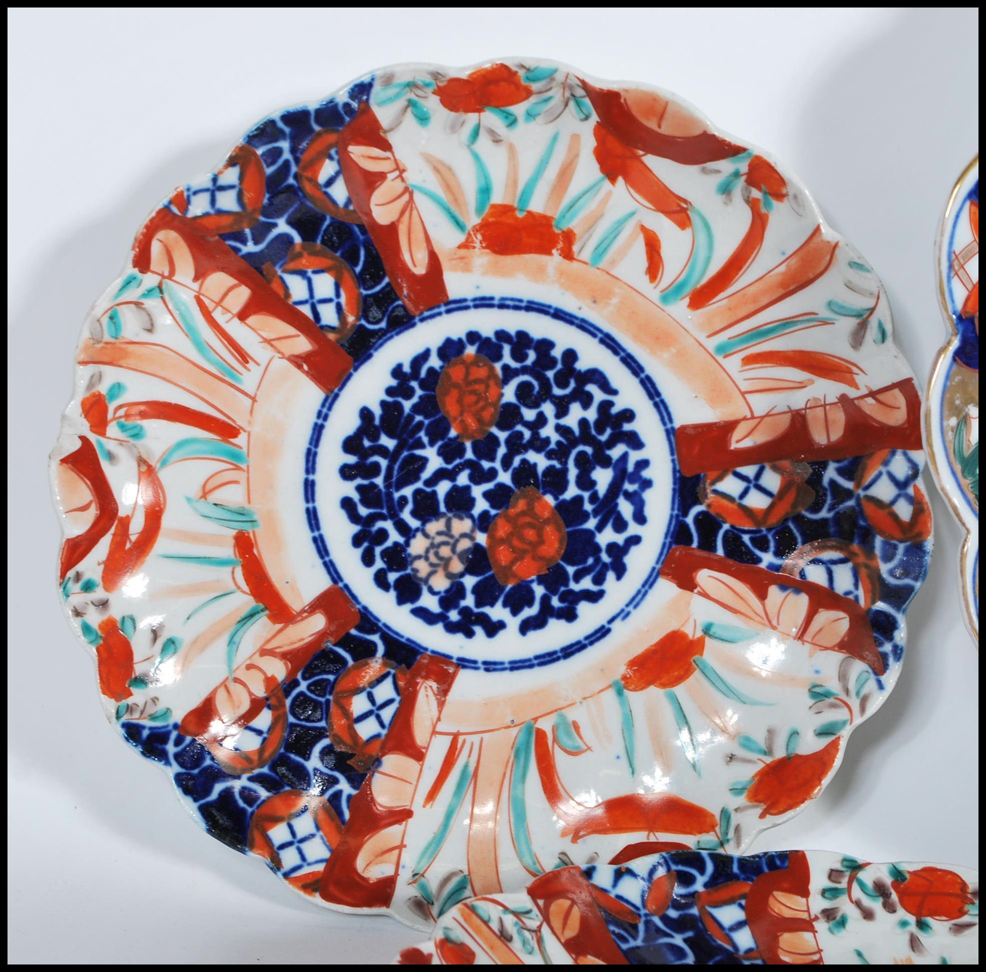 A collection of 20th Century Japanese Imari ceramics to include two wall charger plates having - Image 2 of 15