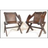 A pair of late 19th to early 20th Century oak ecclesiastical Glastonbury chairs in the Gothic
