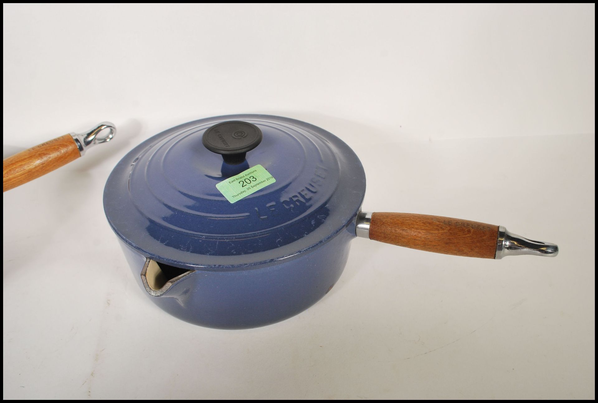 A pair of 20th Century Le Creuset lidded stove top cast iron sauce pans, each fitted with a turned - Image 4 of 5