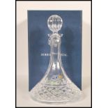 A vintage 20th Century Bohemia cut glass ships decanter having a curved neck and cut glass