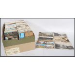A shoebox full of various mixed small postcards dating from the early 20th Century (mostly later) to