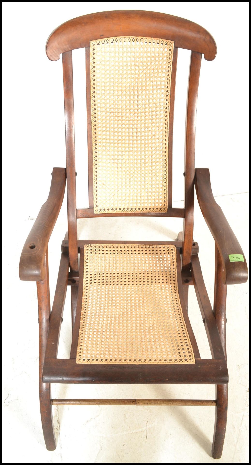 An early 20th Century campaign folding steamer chair of beech construction having caned backrest and - Image 5 of 5