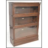 An Edwardian / early 20th century oak Globe Wernicke stacking lawyers bookcase cabinet in three