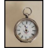 A mid 20th Century continental silver pocket fob watch having engraved floral decoration to the case