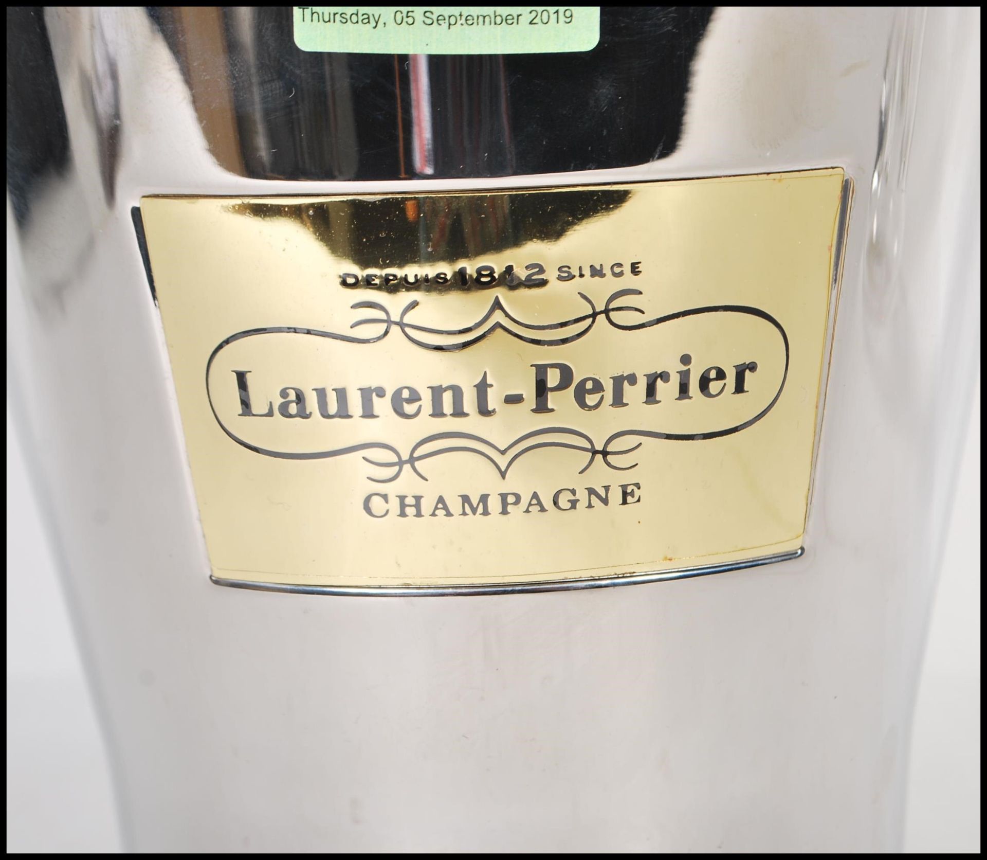A vintage Laurent Perrier brushed steel champagne ice bucket having a leather swing handle and - Bild 2 aus 4