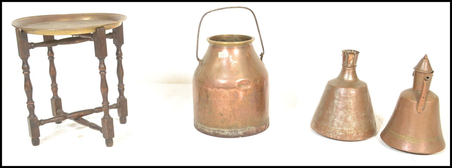 A 19th Century copper milk churn together with two Persian style hand worked coffee pots and a