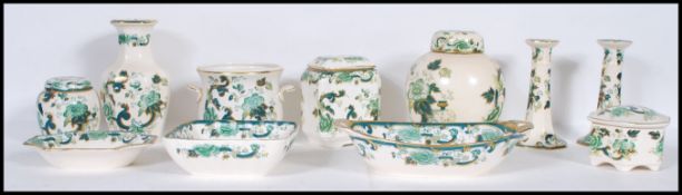 A collection of Mason's ' Chartreuse ' pattern ceramics to include ginger jars, lidded pots,