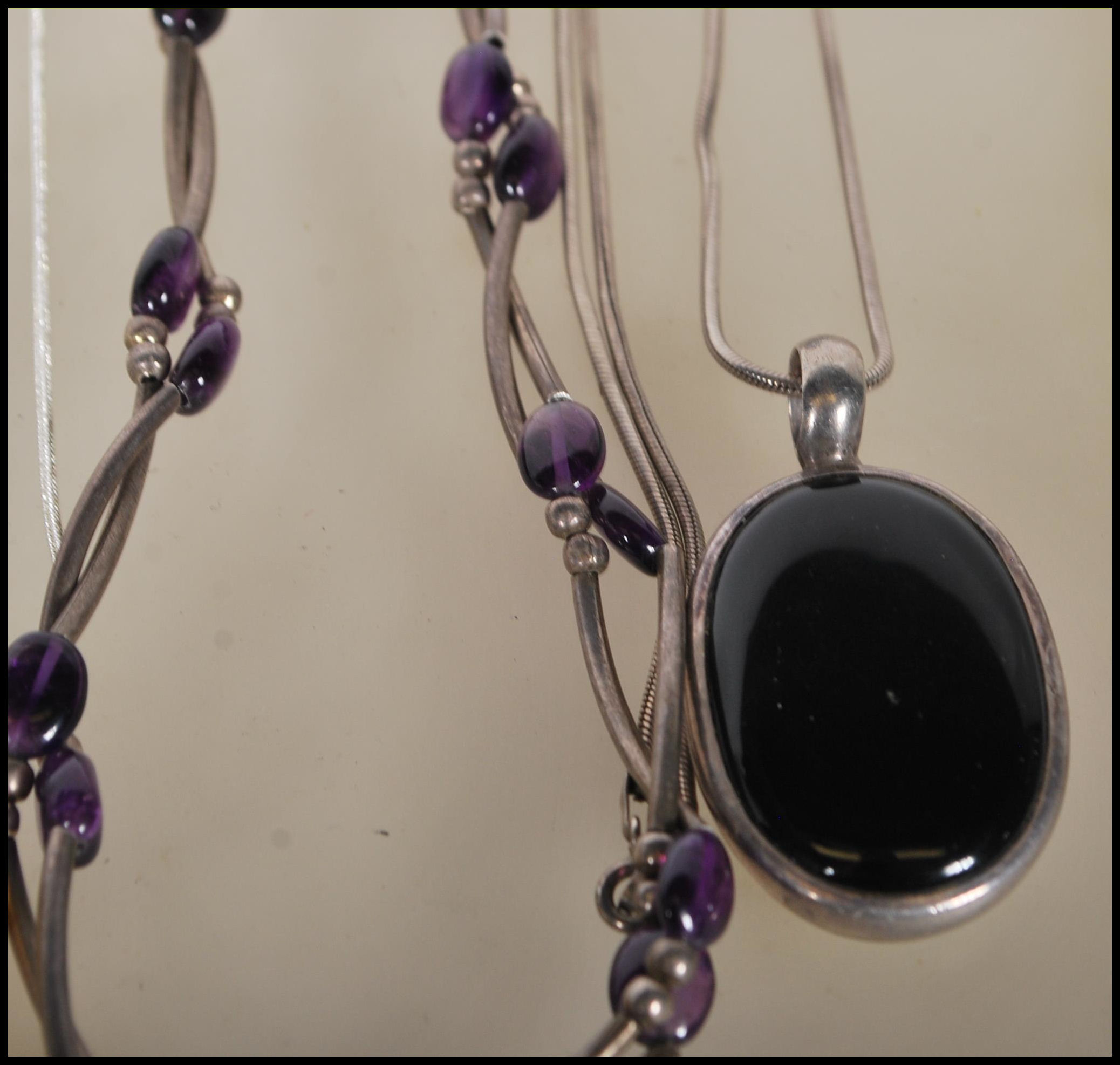 A selection of silver necklaces to include a spacer necklace with purple beads, a snake chain - Image 4 of 8