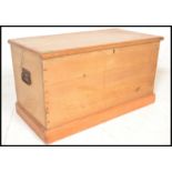 A 19th Century Victorian pine blanket box chest, hinged top with open storage, carry handles to