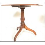 A 19th Century Victorian mahogany pedestal tilt top wine / occasional table, the rectangular top