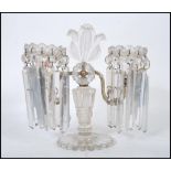 A 19th Century Victorian twin branch table centerpiece lustre with clear glass droplets, raised on a