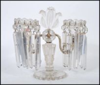 A 19th Century Victorian twin branch table centerpiece lustre with clear glass droplets, raised on a