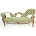 A 19th Century Victorian walnut show frame scroll back sofa, button upholstered in green dralon