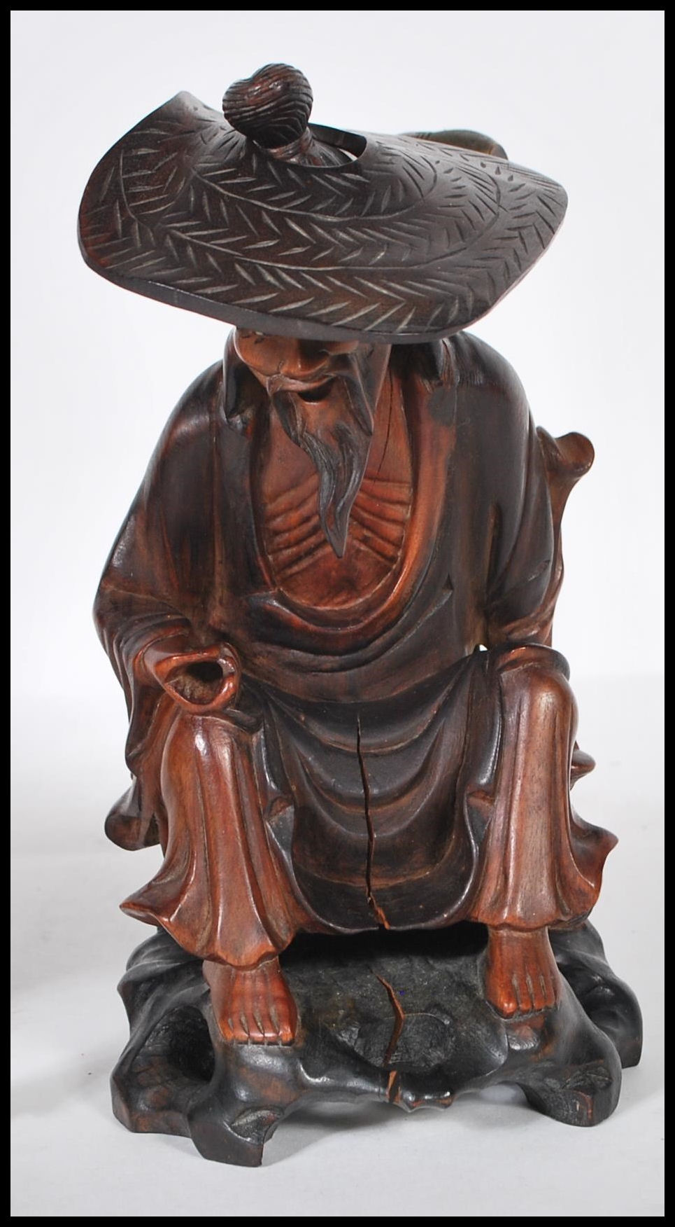 A group of 20th Century Chinese carved hardwood figurines to include a flute player riding on a - Image 4 of 5