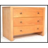 A Century Gordon Russell Cotswold School oak chest of drawers, three straight drawers with turned
