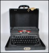 A vintage early 20th Century circa 1930's Underwood universal portable reporters typewriter, in