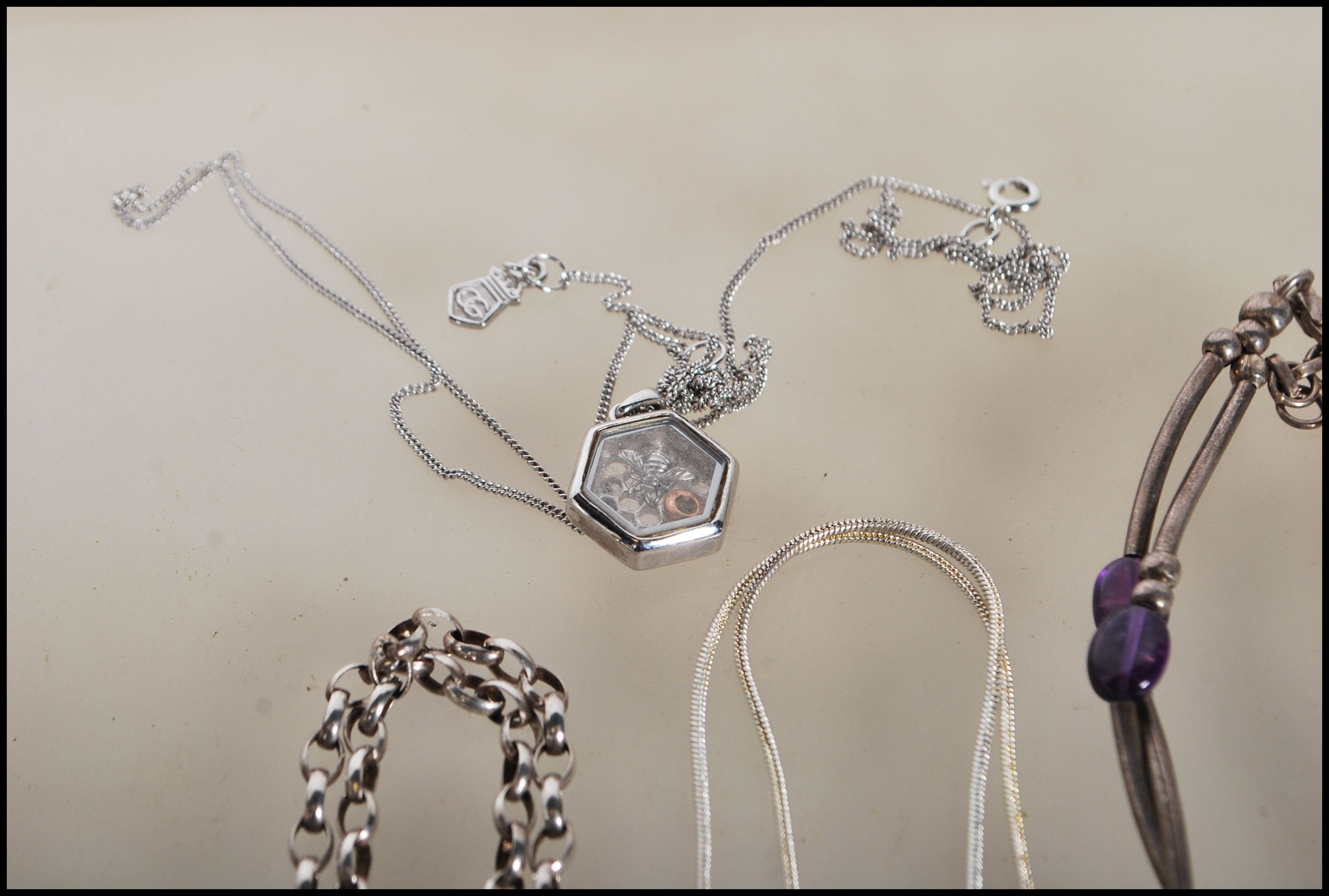 A selection of silver necklaces to include a spacer necklace with purple beads, a snake chain - Image 8 of 8