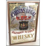 A 20th Century pub advertising mirror for Scottish Chivas Regal. The mirror with scrolling borders