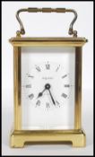 A mid-20th century French 8 Day carriage clock by Bayard. The brass case with glass viewing panels