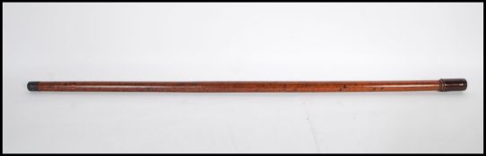 A 20th Century concealed pipe walking stick cane having a dark wood knop which removes to form a