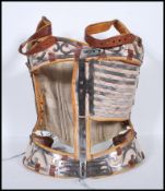 A 19th / 18th Century antique medical correctional back brace corset, possibly for scoliosis,