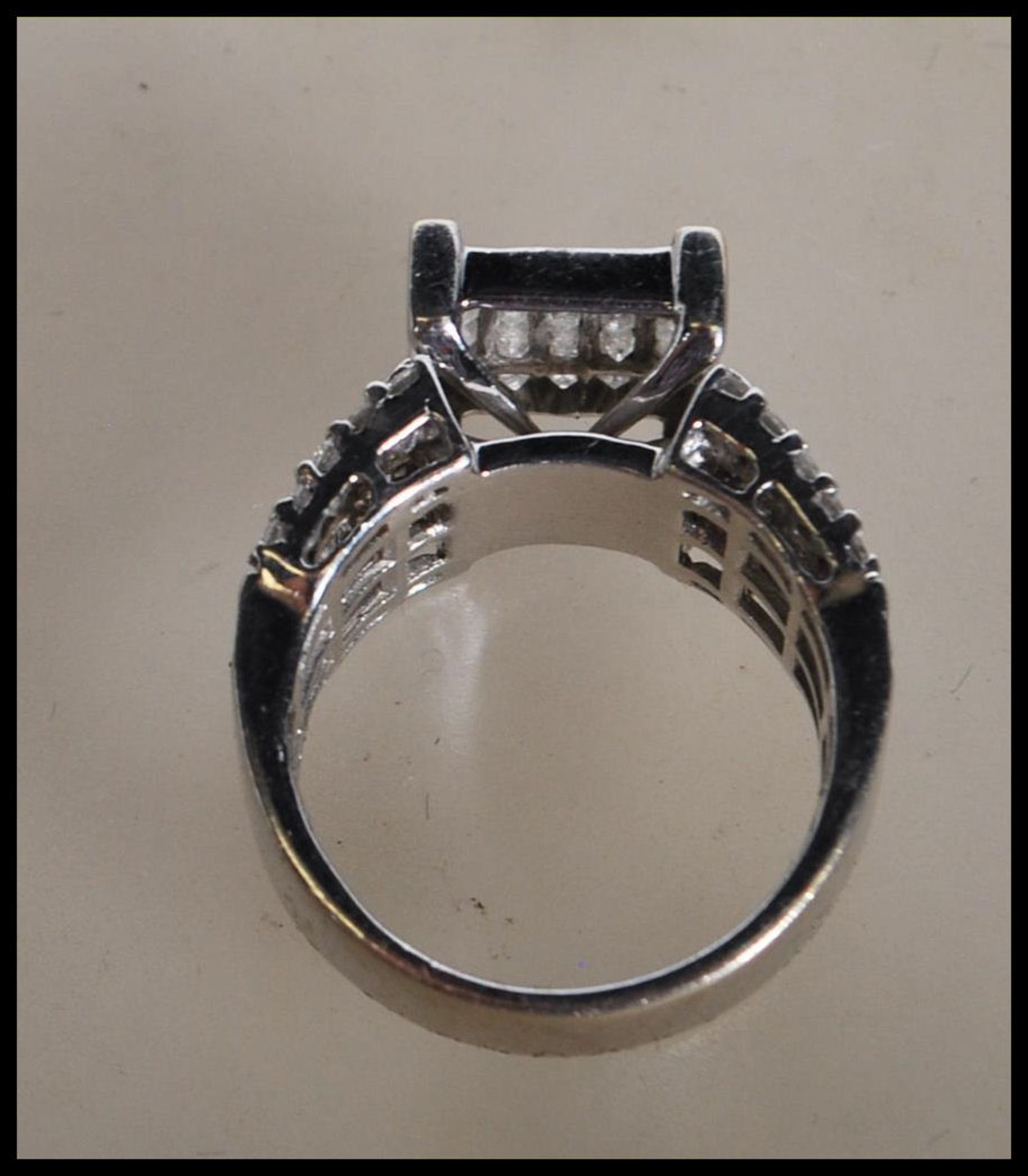 A stamped 14ct white gold and diamond ring. The head having a pave set of diamonds on a suspended - Bild 4 aus 5