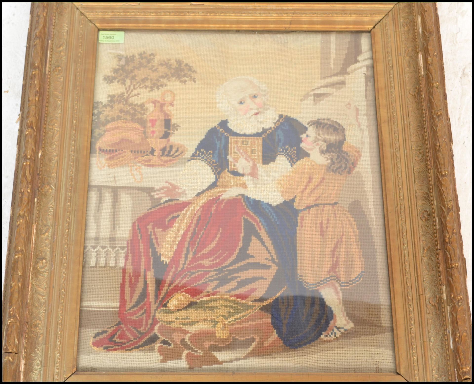 A 19th Century framed and glazed needlework tapestry depicting a seated religious gentleman beside a - Bild 4 aus 5