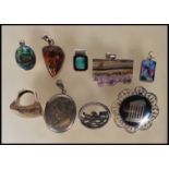 A  selection of silver jewellery to include a stamped 925 silver antiquity brooch, an oval locket