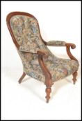 A 19th century Victorian mahogany Library / Salon / elbow chair upholstered in a floral fabric