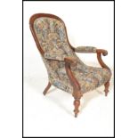 A 19th century Victorian mahogany Library / Salon / elbow chair upholstered in a floral fabric