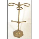 A late 19th / early 20th Century brass umbrella stand constructed from a hexagonal base with a