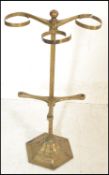 A late 19th / early 20th Century brass umbrella stand constructed from a hexagonal base with a