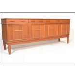 A mid 20th Century retro teak wood sideboard credenza of Danish influence having four short