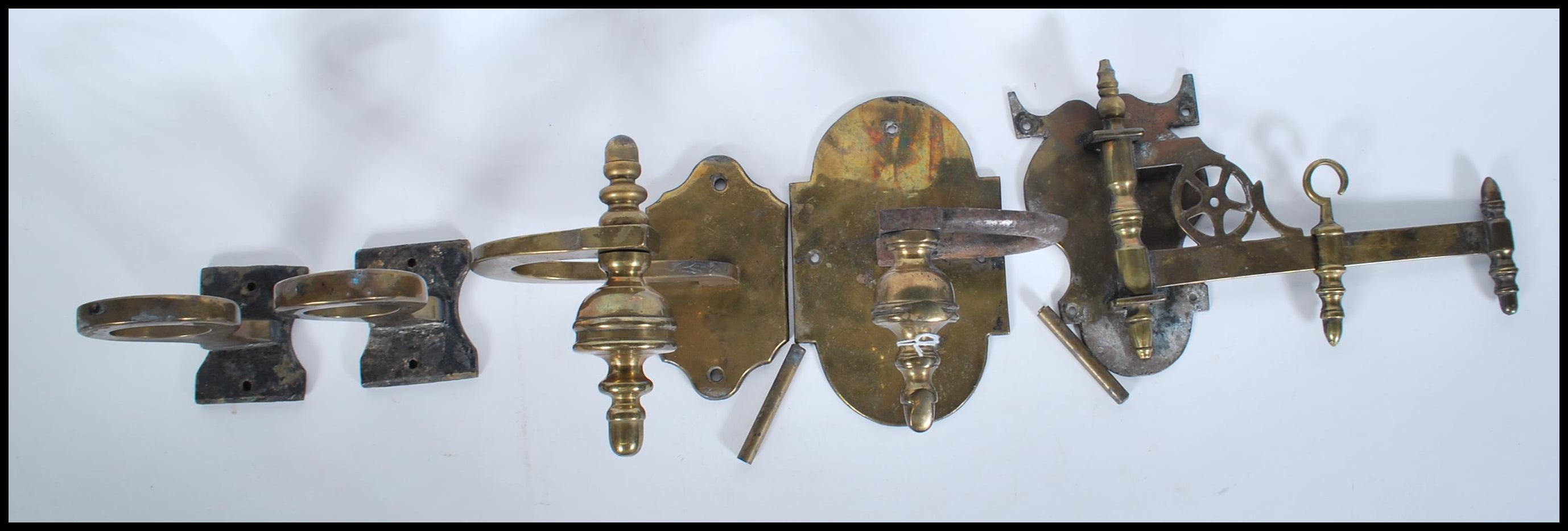 A small group of vintage brass brackets to include
