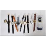 A collection of eleven / 11 gents Quartz movement wrist watches, most appear to be working to