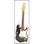 A vintage 20th Century Nevada stratocaster style electric guitar having black paintwork to the