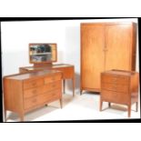 A vintage mid 20th Century bedroom suite consisting of double wardrobe,  matching kneehole