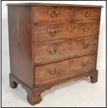 A 19th Century Georgian mahogany chest of drawers. The bank of two over three drawers raised on