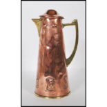 An late 19th Century / early 20th Century WMF arts and crafts pitcher / lidded jug having repousse