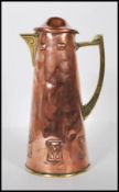 An late 19th Century / early 20th Century WMF arts and crafts pitcher / lidded jug having repousse