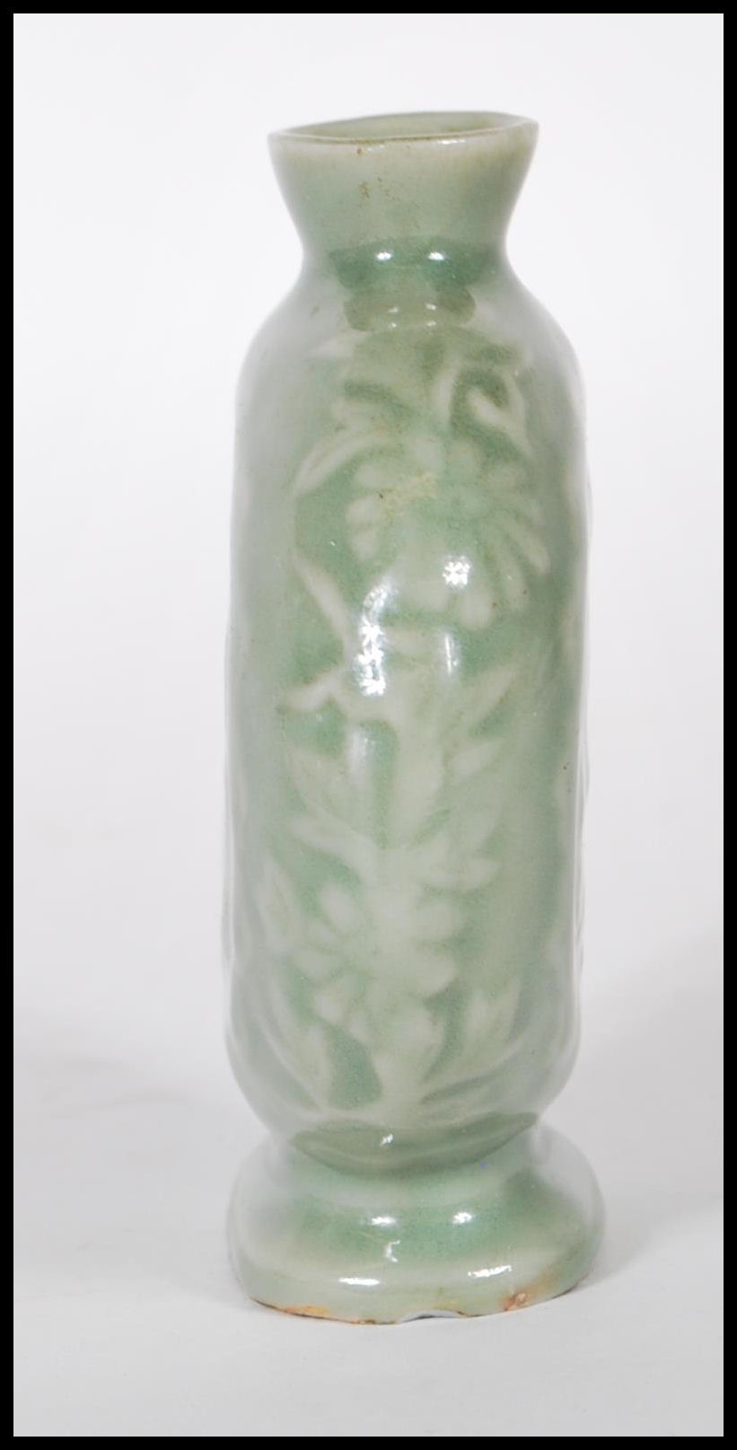 A 19th Century Chinese ceramic bottle / moon flask having a green glaze finish with floral relief - Image 5 of 7