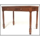 A mid 20th Century oak writing desk table, flared