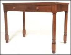 A mid 20th Century oak writing desk table, flared