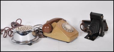 A group of three 20th Century items to include a 1970's two tone ring dial telephone, a early chrome