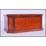 A 19th Century oak sewing work box of hexagonal form having decorative quarter veneer mahogany