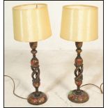 A pair of 19th Century Japanned enamelled and lacquered candlesticks converted into table lamps