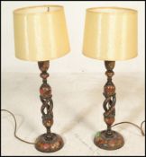 A pair of 19th Century Japanned enamelled and lacquered candlesticks converted into table lamps