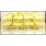 A set of twelve / 12 retro 20th Century metal tubular folding festival / cafe / bistro chairs