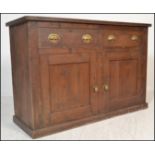 A 19th Century Victorian pine dresser base, flared top over drawers and cupboards fitted with cup