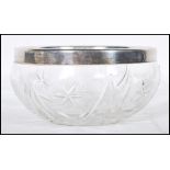 An early 20th Century cut glass centerpiece bowl having an English hallmarked collar. Hallmarked